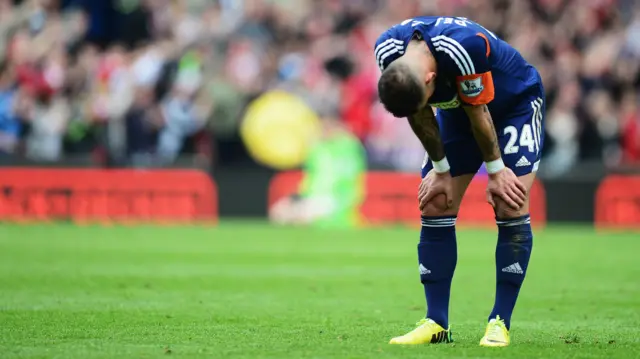 Fulham player dejected after being relegated in 2014