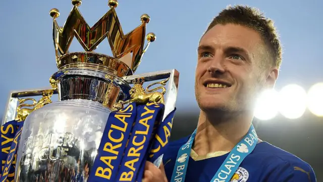 Jamie Vardy holds the Premier League trophy