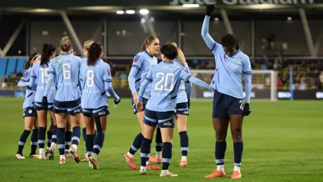 Khadija Shaw celebrates after scoring her first goal against Liverpool for Manchester City