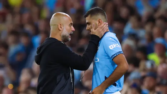 Pep Guardiola with Rodri