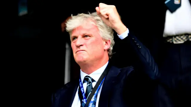 Coventry owner Doug King punches in the air in delight in the stands