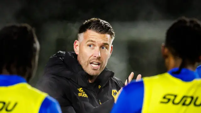 Rob Edwards talking to players during Wolves training