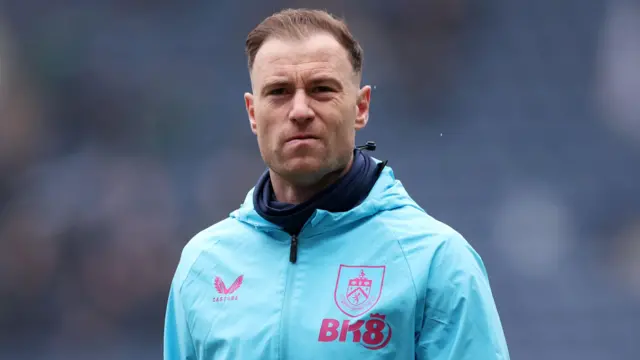 A picture of a serious-looking Ashley Barnes in a sky blue Burnley training jacket