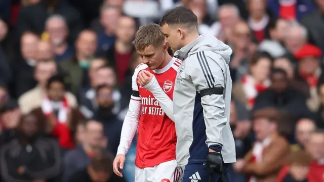 Martin Odegaard walks off pitch with physio