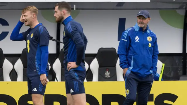 Steve Clarke watches on as Tommy Conway and Anthony Ralston train for Scotland