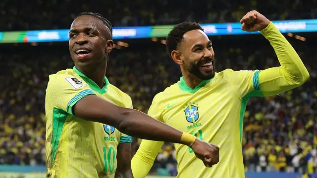 Matheus Cunha (right) celebrates Brazil's first-half winner against Paraguay with Vinicius Jr that confirmed their place at next summer's World Cup