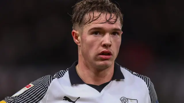 Liam Thompson wearing a Derby shirt looks straight forward