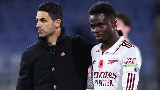 Mikel Arteta and Bukayo Saka