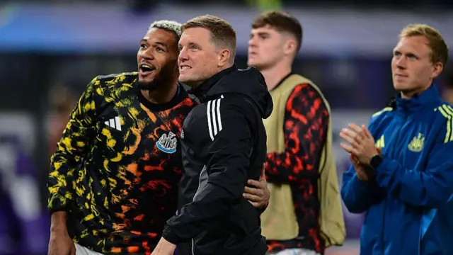 Joelinton and Eddie Howe embrace after full-time