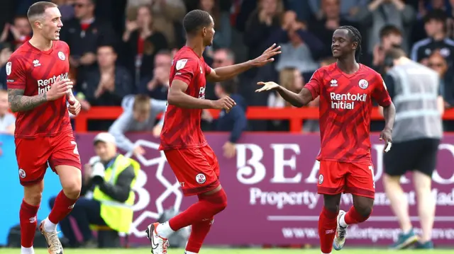 Junior Quitirna of Crawley Town celebrates scoring a goal