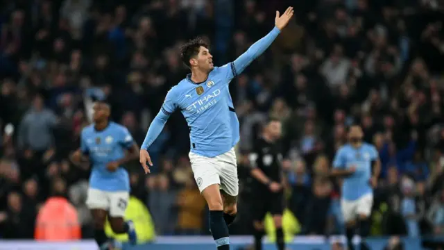 Manchester City's English defender #05 John Stones scores the equalising goal during the English Premier League football match between Manchester City and Arsenal at the Etihad Stadium