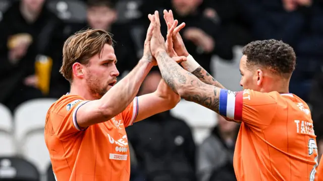 Tuur Rommens celebrates with James Tavernier after scoring against St Mirren