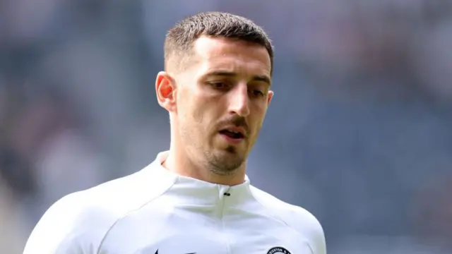 Lewis Dunk of Brighton & Hove Albion warms up prior to the Premier League match between Newcastle United and Brighton & Hove Albion at St. James Park on May 11, 2024