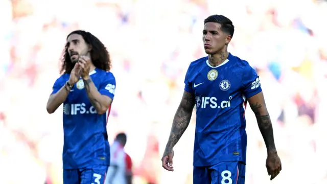 Enzo Fernandez looks dejected as Marc Cucurella applauds fans