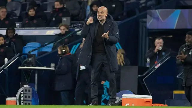 Pep Guardiola gesticulates on the touchline
