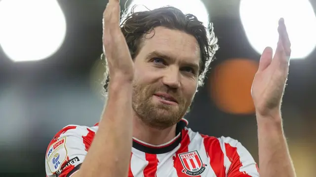 Sam Gallacher applauds the Stoke City supporters following their win over Norwich