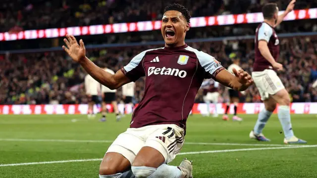Ollie Watkins celebrates scoring for Aston Villa against Liverpool.