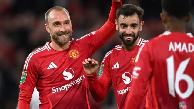 Christian Eriksen celebrates a goal for Manchester United alongside Bruno Fernandes