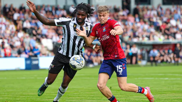 Fraser Murray and Richard Taylor battle for possession