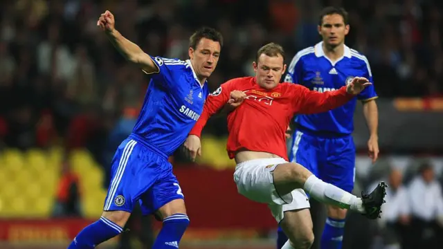 Wayne Rooney and John Terry tussle for the ball