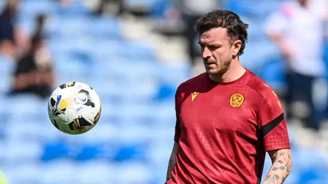 Andy Halliday warms up before a Motherwell Premiership match
