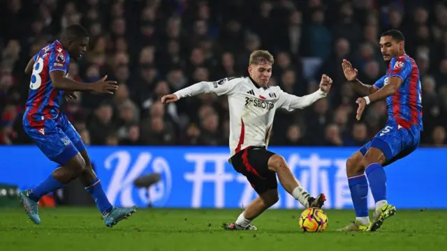 Emile Smith-Rowe and Maxence Lacroix compete for the ball