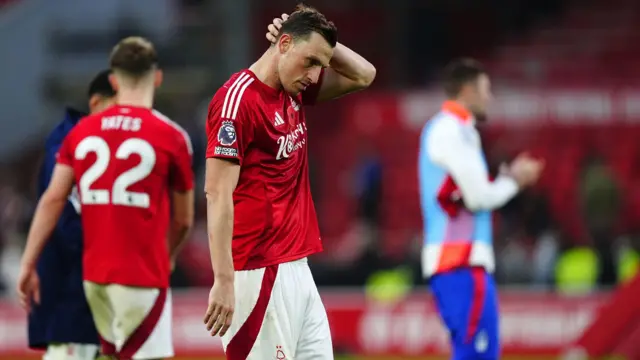 Chris Wood stands dejected after a Nottingham Forest defeat