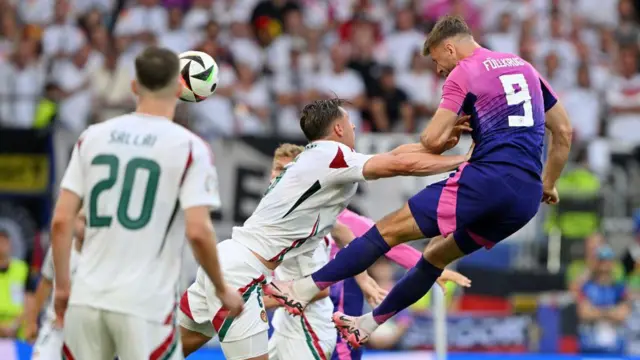 Niclas Fullkrug of Germany competes for a header