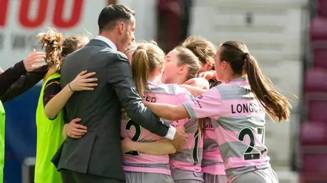 Partick Thistle's Rachel Donaldson celebrates with teammates and manager Brian Graham after making it 1-1 during the Sky Sports Cup Final