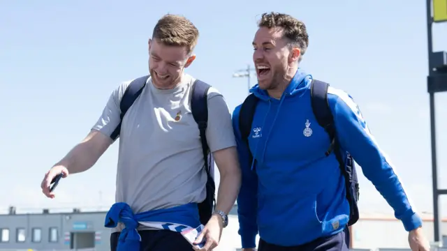 Stuart Findlay and Marley Watkins are full of the joys as Kilmarnock depart Glasgow Airport for Tromso on Wednesday