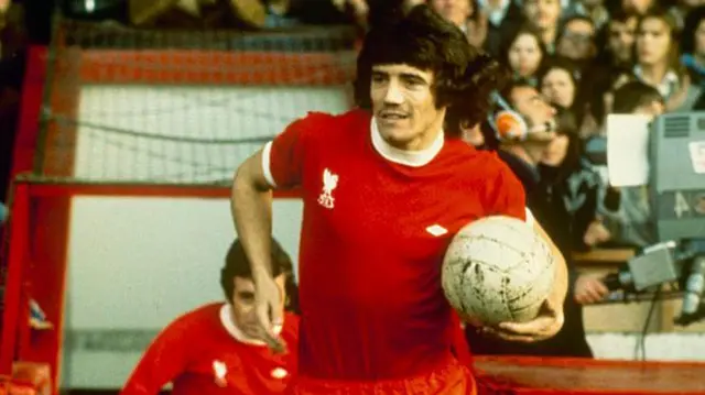 Kevin Keegan of Liverpool runs out of the player's tunnel with the ball