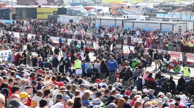 A packed grid and grandstand at the sunsoaked main race day at the 2024 North West 200