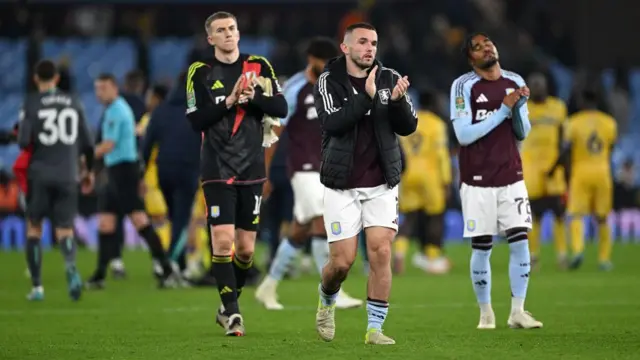 Aston Villa players look despondent at the final whistle after losing to Crystal Palace in the EFL Cup