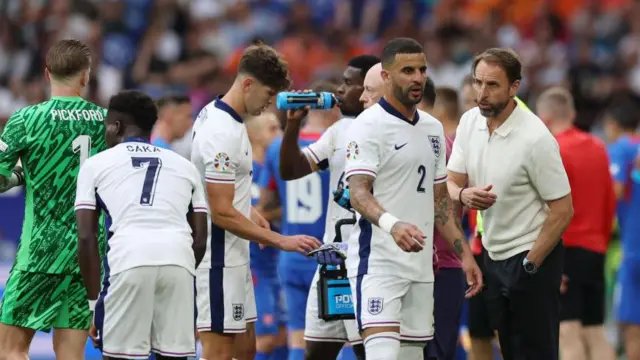 Kyle Walker speaks to Gareth Southgate