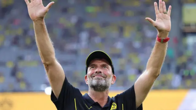 Jurgen Klopp waves to Borussia Dortmund fans