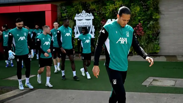 Virgil van Dijk leads the Liverpool players out for training