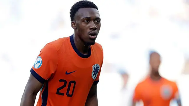 Antoni Milambo plays for the Netherlands and wears their orange kit