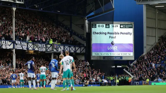 Screen alerts the crowd of a VAR check during the Premier League match between Everton and Newcastle United at Goodison Park