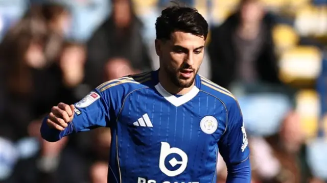 Leicester City striker Julian Carranza, wearing the club's navy blue home shirt, in action