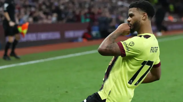 Lyle Foster celebrates scoring a goal for Burnley