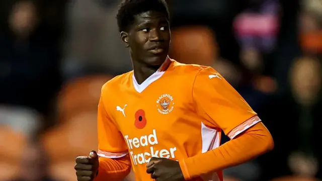 Terry Bondo in action for Blackpool wearing their tangerine home shirt