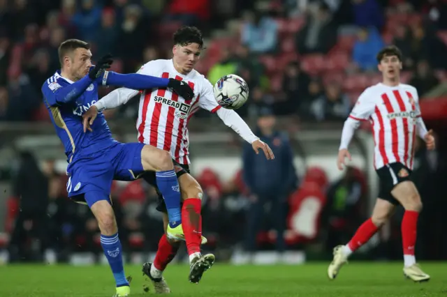 Jenson Seelt of Sunderland is being challenged by Jamie Vardy of Leicester City during the Championship match between Sunderland and Leicester City at the Stadium of Light in Sunderland