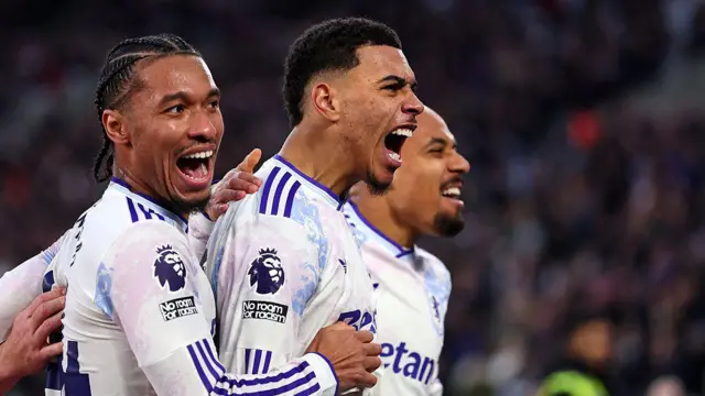 Morgan Rogers celebrates scoring his team's third goal with teammates Boubacar Kamara and Donyell Malen