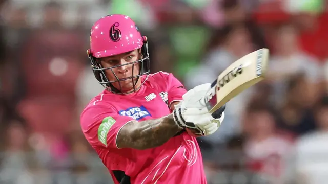 Sydney Sixers batter Josh Philippe plays a shot