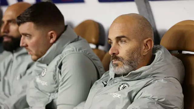 Enzo Maresca looks on thoughtfully from the dugout