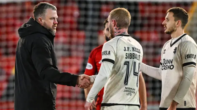 Aberdeen manager Jimmy Thelin shakes hands with Dundee United players