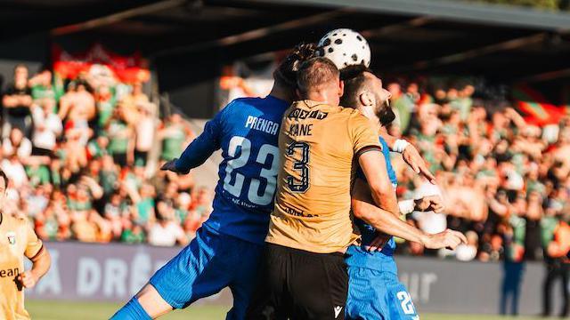 Marcus Kane attempts to clear the ball against RFS in Riga