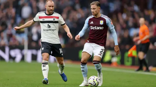 Matty Cash is pressured by Christian Eriksen