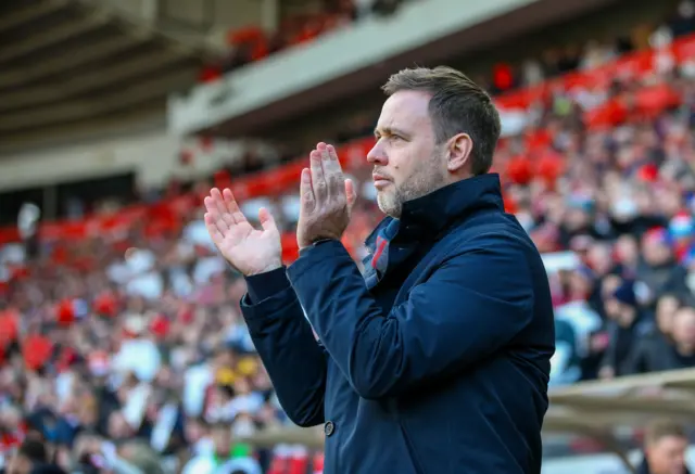 Michael Beale applauds at the Stadium of Light