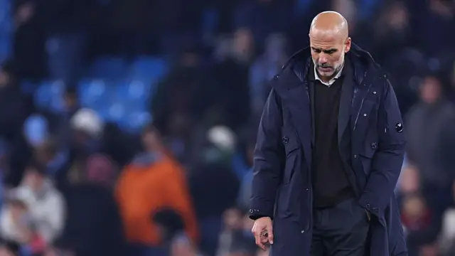 Pep Guardiola with him head down 